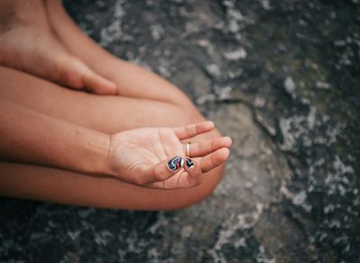 Close-up of hands in a specific yoga position showing concentration.